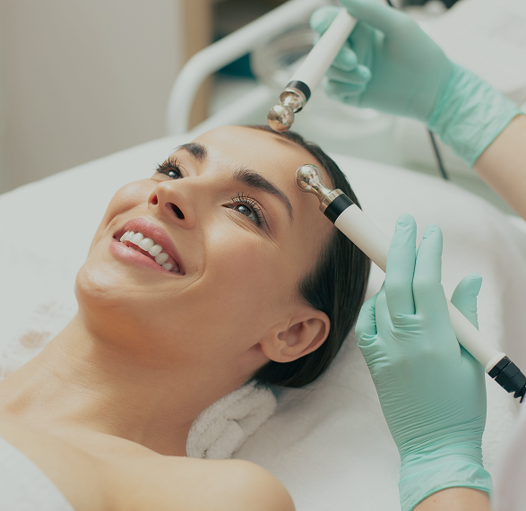 cheerful young lady smiling while having useful procedure microcurrent therapy medical center 1